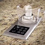 food processor built into a brown granite counter top 